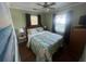 Well-lit bedroom features a comfortable bed, bedside tables, and a dresser at 3031 56Th S St, Gulfport, FL 33707