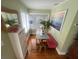 Bright dining area features a bench seat, dining table, hardwood floors, and natural light at 3031 56Th S St, Gulfport, FL 33707