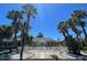 Charming home with a white picket fence and mature palm trees at 3031 56Th S St, Gulfport, FL 33707