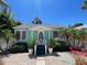 Inviting light blue exterior with a decorative door and well-manicured landscaping at 3031 56Th S St, Gulfport, FL 33707