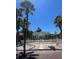 Charming home with a white picket fence and mature palm trees at 3031 56Th S St, Gulfport, FL 33707