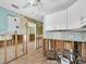 This kitchen is undergoing renovations but features white cabinets and tile backsplash at 3031 56Th S St, Gulfport, FL 33707