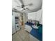 Cozy kitchen with white appliances, blue countertops, and decorative backsplash at 3031 56Th S St, Gulfport, FL 33707