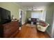 Living area featuring hardwood floors, ample natural light, and comfortable furnishings at 3031 56Th S St, Gulfport, FL 33707