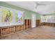 Open living space features large windows, hardwood floors, and exposed walls at 3031 56Th S St, Gulfport, FL 33707