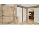 Bathroom with tiled walk-in shower and access to the main bedroom at 30703 San An Rd, San Antonio, FL 33576