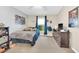 Bedroom showcasing a window, a dark wood dresser, and light-colored walls at 311 Parsons Woods Dr, Seffner, FL 33584