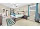 Main bedroom featuring natural light, stylish curtains, and a spacious design at 311 Parsons Woods Dr, Seffner, FL 33584