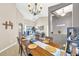 Dining area with wood table and a chandelier at 311 Parsons Woods Dr, Seffner, FL 33584