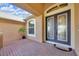 Inviting front porch featuring decorative double doors and brick flooring at 311 Parsons Woods Dr, Seffner, FL 33584