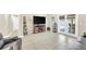 Bright, open living room with hardwood floors and access to the patio at 311 Parsons Woods Dr, Seffner, FL 33584