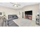 Open living room featuring neutral walls, modern furniture, and large-screen TV at 311 Parsons Woods Dr, Seffner, FL 33584