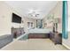 Spacious main bedroom displaying a bed, dresser, and natural light at 311 Parsons Woods Dr, Seffner, FL 33584