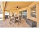 Covered patio features a ceiling fan and an outdoor dining set at 311 Parsons Woods Dr, Seffner, FL 33584