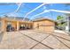 Large screened-in pool enclosure features a spacious patio at 311 Parsons Woods Dr, Seffner, FL 33584