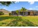 The home has a large backyard with a screened in porch, offering privacy and space at 31105 Whitlock Dr, Wesley Chapel, FL 33543