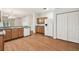 Spacious kitchen features wood cabinets, granite counters, white appliances, and light wood floors at 31105 Whitlock Dr, Wesley Chapel, FL 33543
