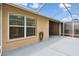The enclosed lanai with light colored concrete floor offers a serene outdoor living experience at 31105 Whitlock Dr, Wesley Chapel, FL 33543