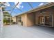 Spacious lanai with a ceiling fan perfect for relaxing and entertaining while enjoying the outdoors at 31105 Whitlock Dr, Wesley Chapel, FL 33543