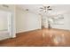 Bright living room with wood floors, ceiling fan, and open floor plan at 31105 Whitlock Dr, Wesley Chapel, FL 33543