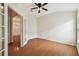 Office space featuring wood-look flooring and a large window and french doors leading to other rooms at 31105 Whitlock Dr, Wesley Chapel, FL 33543