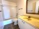 Bathroom featuring a tub with shower, single sink vanity, and neutral tile flooring at 3276 38Th S Way # D, St Petersburg, FL 33711