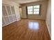 Bright bedroom with hardwood floors, closet and window, offering a comfortable living space at 3276 38Th S Way # D, St Petersburg, FL 33711