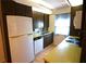Functional kitchen with ample cabinets, stainless steel sink and appliances, and natural light at 3276 38Th S Way # D, St Petersburg, FL 33711