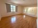 Spacious living room with hardwood floors, large window and ample natural light at 3276 38Th S Way # D, St Petersburg, FL 33711