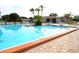 A refreshing swimming pool area featuring poolside seating and clear water at 3276 38Th S Way # D, St Petersburg, FL 33711