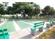 Outdoor shuffleboard courts surrounded by trees, perfect for a relaxing and enjoyable game with friends at 3276 38Th S Way # D, St Petersburg, FL 33711