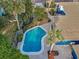 Aerial view of the home featuring a backyard pool, patio and landscaping, set in a neighborhood at 330 Pineapple St, Tarpon Springs, FL 34689