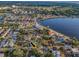 Aerial view showing the property's location near the waterfront and surrounded by mature trees at 330 Pineapple St, Tarpon Springs, FL 34689