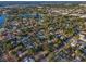 An aerial view highlighting the proximity to the lake, lush landscapes, and beautiful neighborhood at 330 Pineapple St, Tarpon Springs, FL 34689