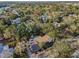 Overhead shot showcasing the backyard pool, mature trees, and classic style of the home's exterior at 330 Pineapple St, Tarpon Springs, FL 34689