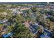 An aerial view of the neighborhood, showcasing the mature trees and vibrant homes at 330 Pineapple St, Tarpon Springs, FL 34689
