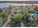 Elevated aerial image displaying mature trees and the home's setting within the residential area at 330 Pineapple St, Tarpon Springs, FL 34689