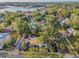 Aerial view of the property, showing the pool, landscaping, and proximity to the street at 330 Pineapple St, Tarpon Springs, FL 34689