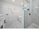 Beautiful bathroom with a freestanding tub, glass shower enclosure, and sleek dual sink vanity for a spa-like feel at 330 Pineapple St, Tarpon Springs, FL 34689
