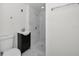 Bright bathroom featuring white tile shower and modern vanity at 330 Pineapple St, Tarpon Springs, FL 34689