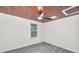 This is a picture of a blank bedroom featuring wood-look flooring, a ceiling fan, and one window at 330 Pineapple St, Tarpon Springs, FL 34689