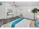 Comfortable bedroom featuring wood-look floors and light-colored walls offers a modern, bright living space at 330 Pineapple St, Tarpon Springs, FL 34689