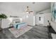 Light-filled bedroom showcasing a walk-in closet, wood-look floors, and a neutral color palette for relaxation at 330 Pineapple St, Tarpon Springs, FL 34689
