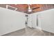 Bedroom with ceiling fan, adjoining bathroom, and kitchenette in view at 330 Pineapple St, Tarpon Springs, FL 34689