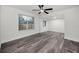 Versatile bonus room filled with light features wood-look floors and backyard views at 330 Pineapple St, Tarpon Springs, FL 34689