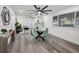 Bright dining area featuring gray wood floors, views to the living room and modern finishes at 330 Pineapple St, Tarpon Springs, FL 34689