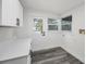 Functional laundry area features a quartz countertop, bright lighting, and ample room for cleaning at 330 Pineapple St, Tarpon Springs, FL 34689