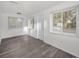 A bright room with laminate floors and natural light at 330 Pineapple St, Tarpon Springs, FL 34689