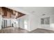 Bright living room and dining room with updated flooring and wood ceiling detail at 330 Pineapple St, Tarpon Springs, FL 34689