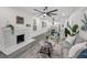The open-concept floor plan connects the living room to the dining and kitchen area, featuring gray wood floors at 330 Pineapple St, Tarpon Springs, FL 34689